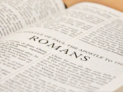 Bible open to the book of Romans