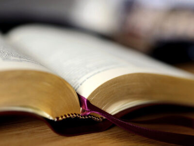 Open Bible on a wood table